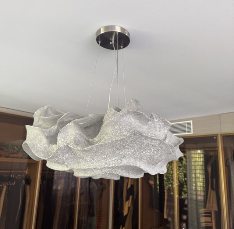 Sculptural cloud-form pendant light in a walk-in robe