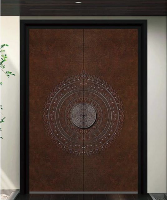 Corten-look double entry door with medallion detail
