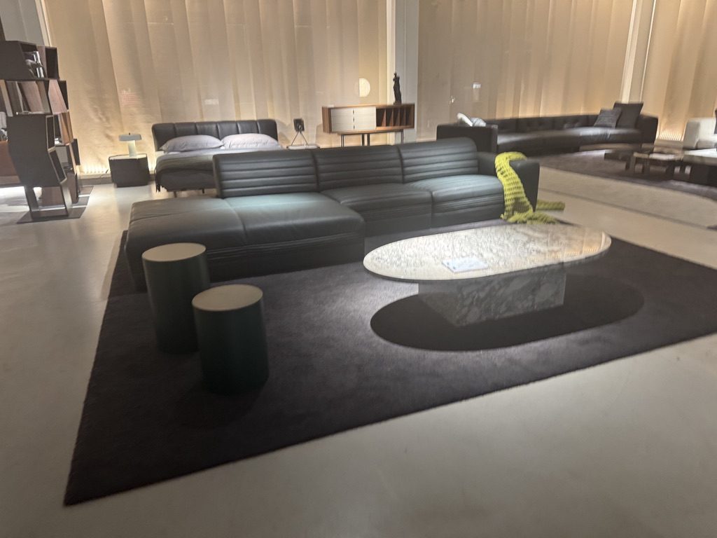 Leather sofa, marble coffee table and rug at a partner factory showroom